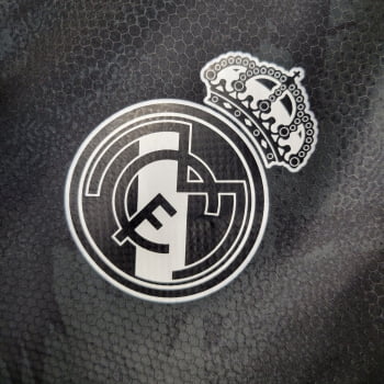 Jaqueta Corta-Vento Real Madrid 23/24 - Preto Camuflado Jaqueta Corta-Vento Real Madrid 23/24 - Preto Camuflado